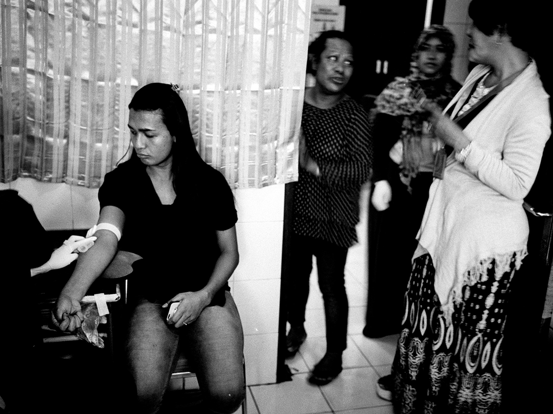 A young transgender having her blood checked for syphilis.